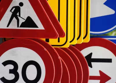 Close-up of different road signs